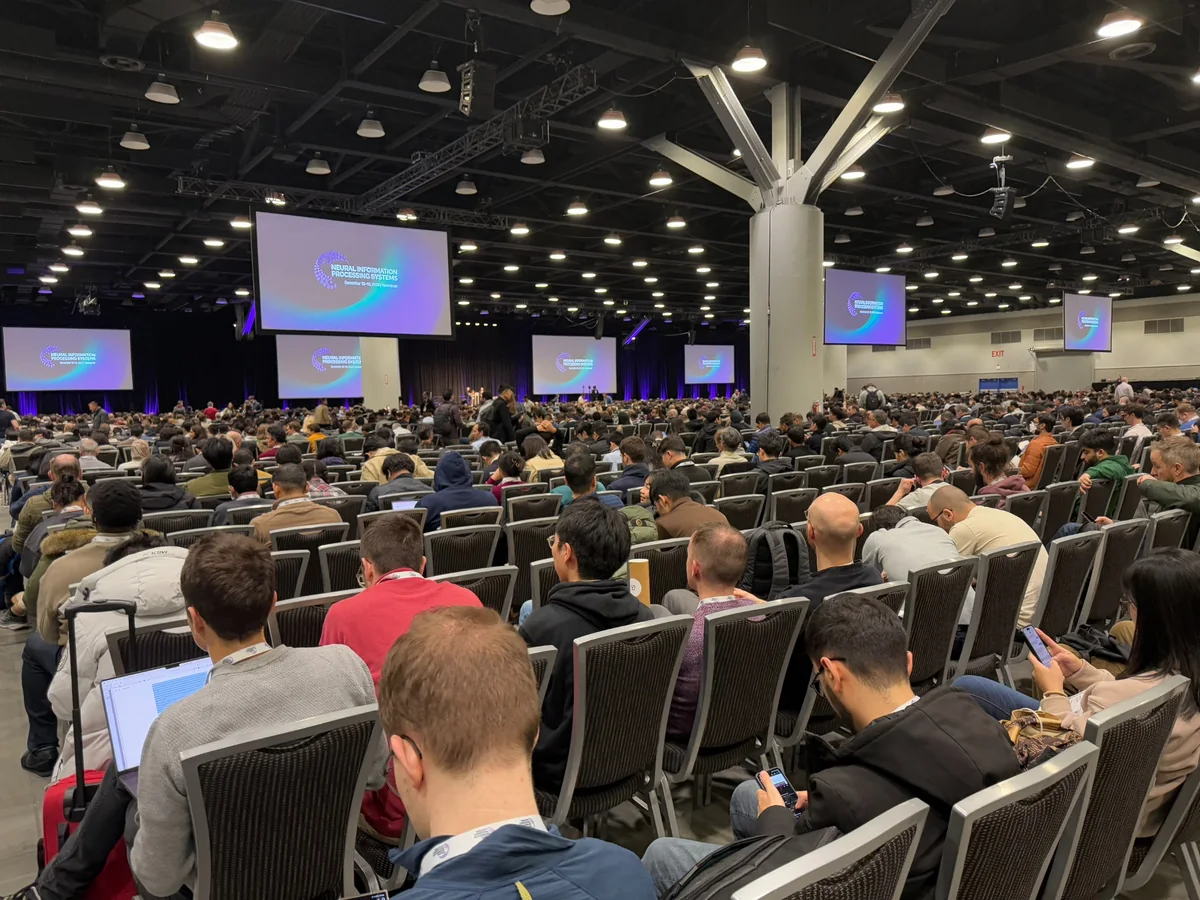 An audience gathered for a conference session at NeurIPS.