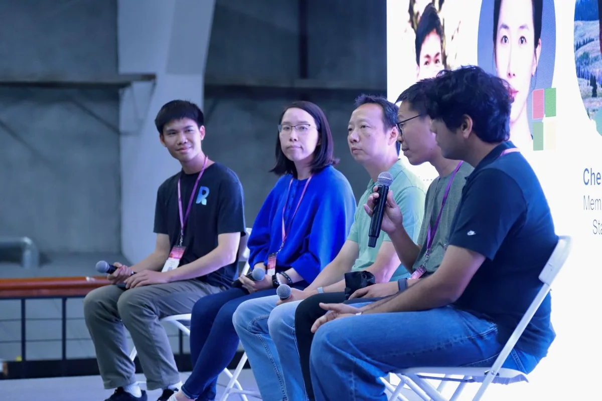 Students and researchers exchanging ideas during a panel discussion.